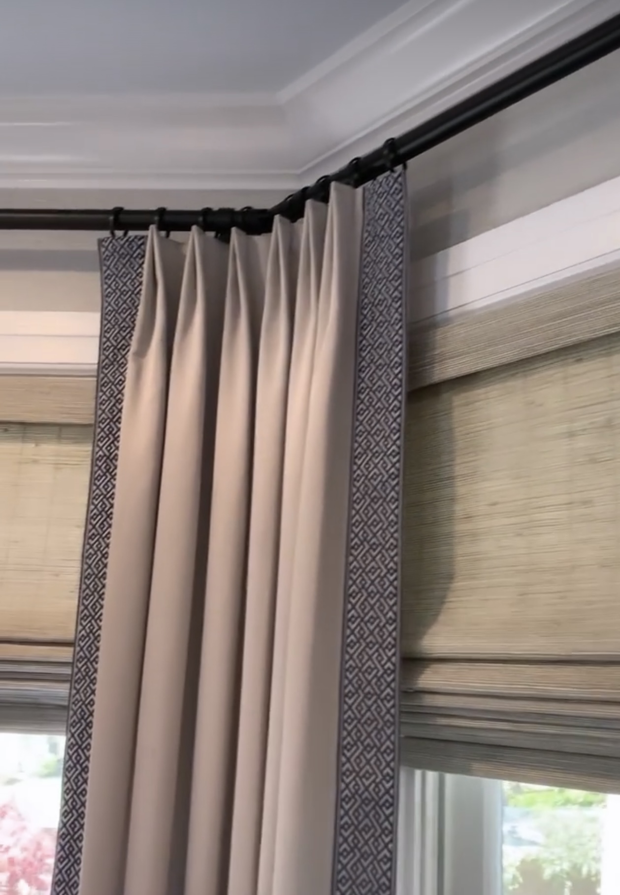 Bay window rod with trim on both sides